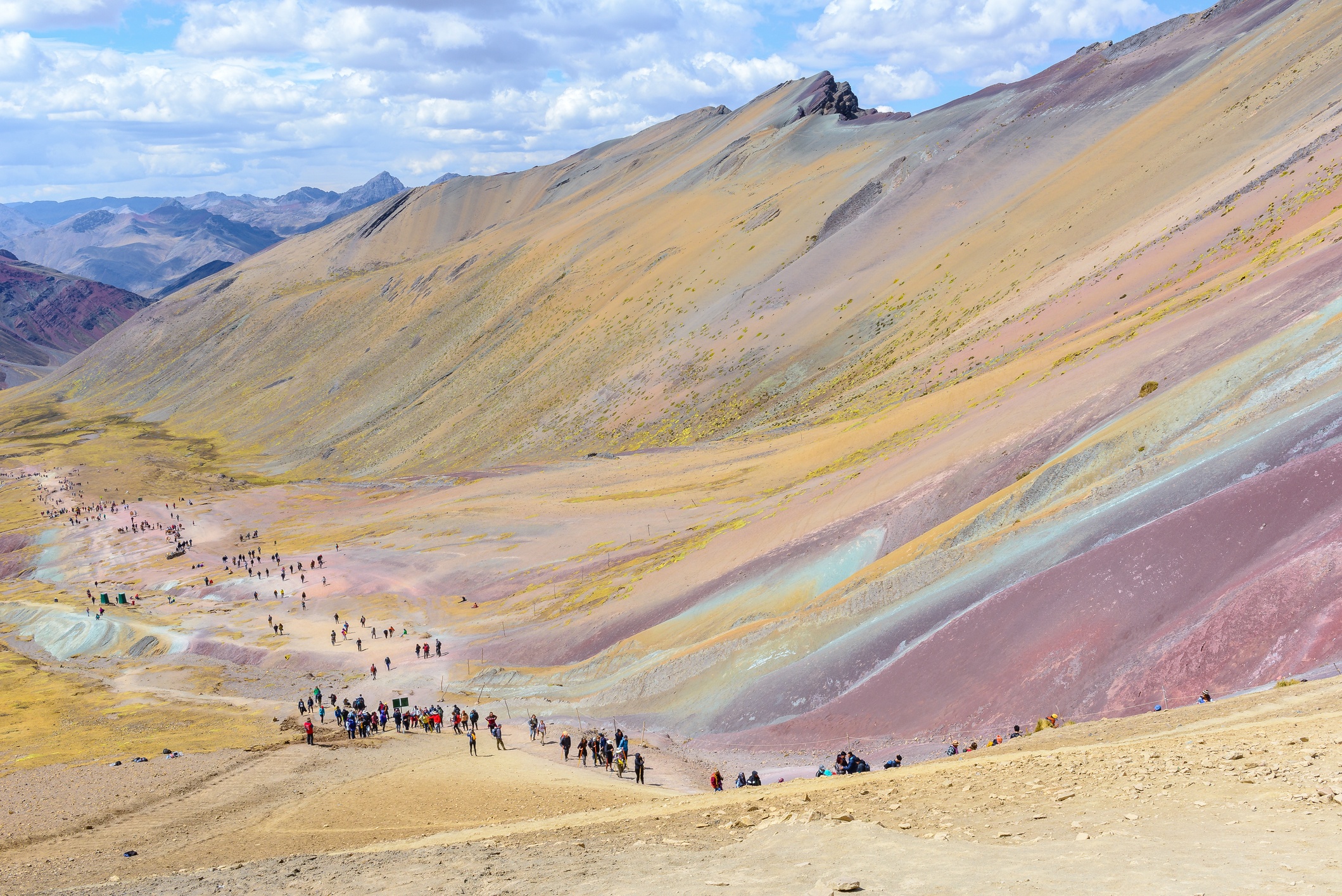 Long line of hikers starting the hike up Rainbow Mountain, Peru