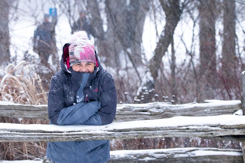 Happy smiling adult winter snow fence