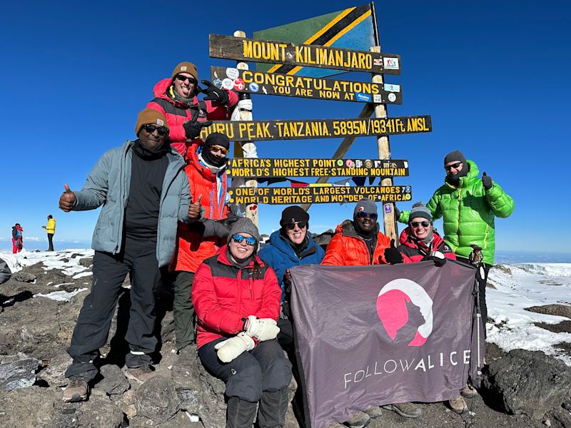 Uhuru Peak, Kilimanjaro summit, group pic with FA flag 1 January 2023 New Year's Eve