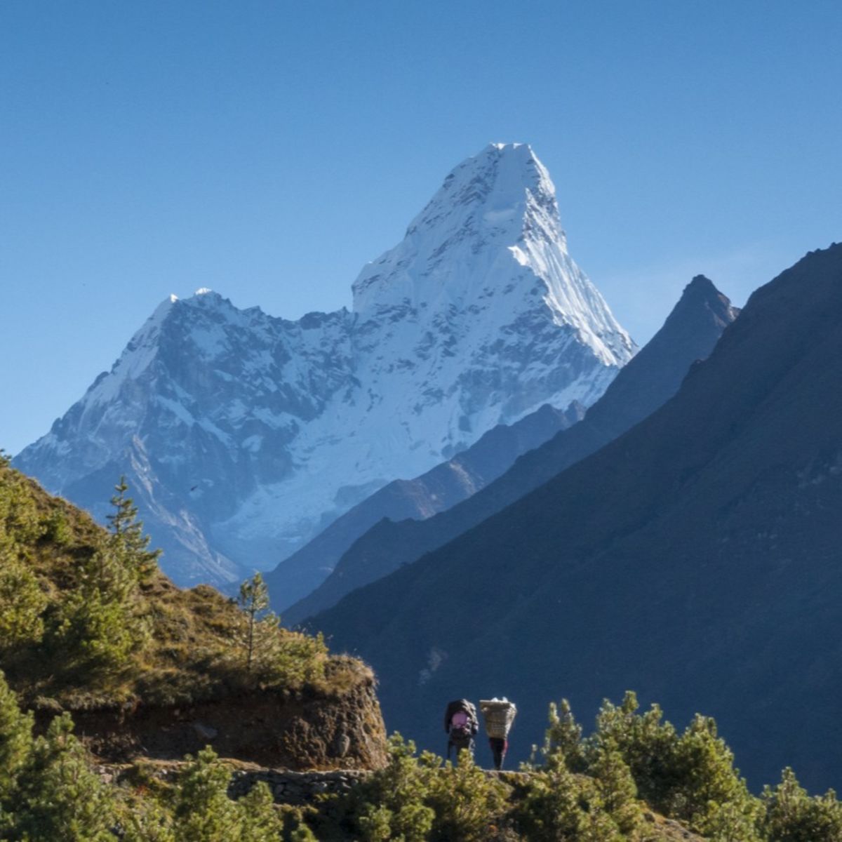 Unidentified nepalese people on the way to Everest base camp. 2016. The way from Namche Bazar to Tengboche village.