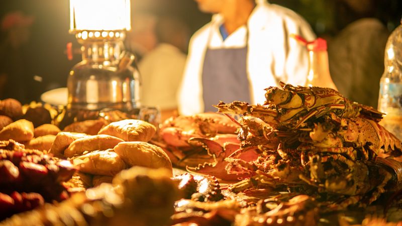 Zanzibari night street food market in Forodhani Gardens. Stone Town, Zanzibar City, Unguja island, Tanzania.