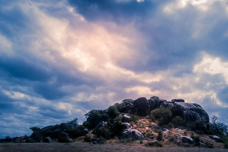 Serengeti National Park moody cloudy stormy sky over outcrop