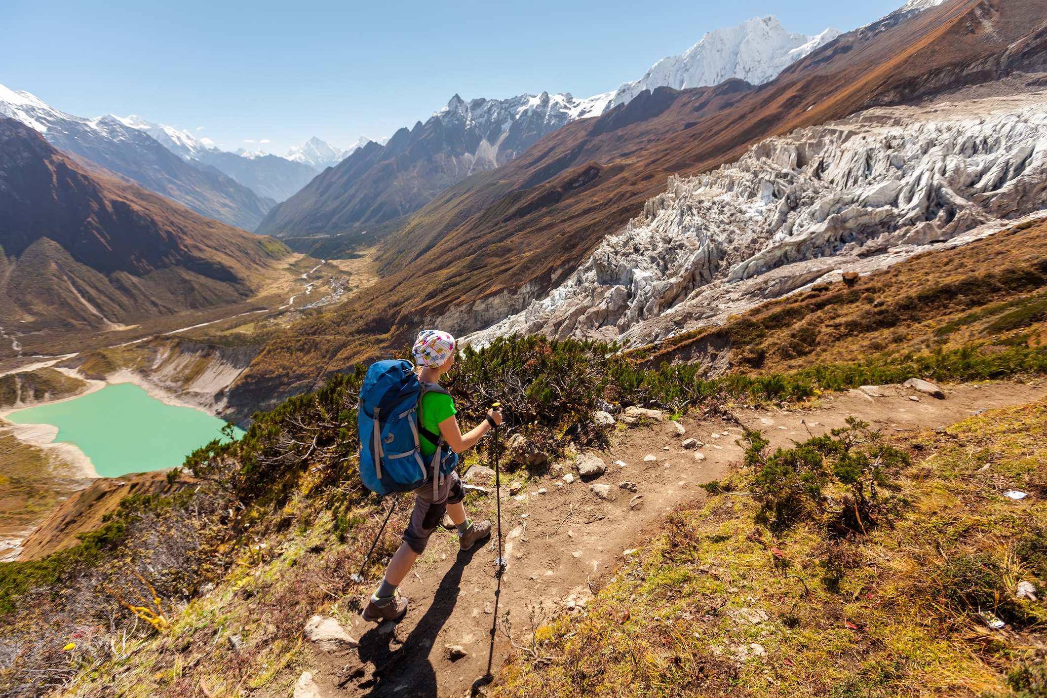 Hiker is climbing to Manaslu Base Camp in highlands of Himalayas on Manaslu Circuit.