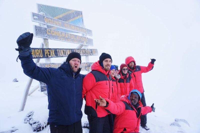 Group Celebrating Kilimanjaro Summit