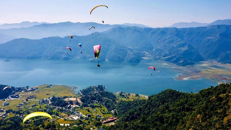 Paragliders over Phewa Lake and Pokhara, Nepal, Annapurna Circuit route