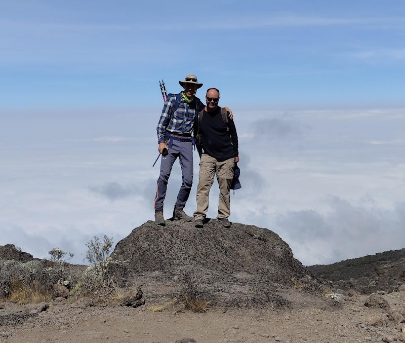 Climbers smiling at top of Barranco Wall on Kilimanjaro