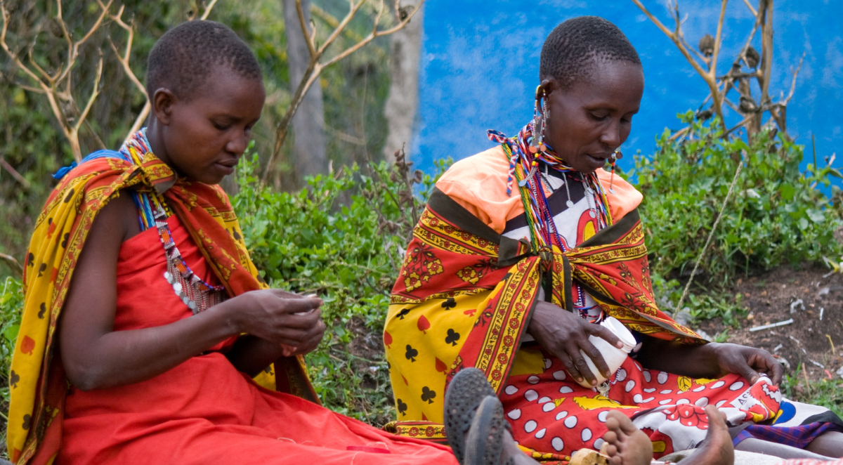 Women making traditional necklaces