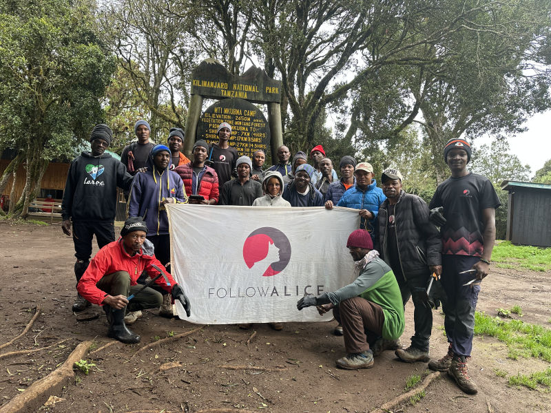 Kilimanjaro mountain crew group photo with FA flag