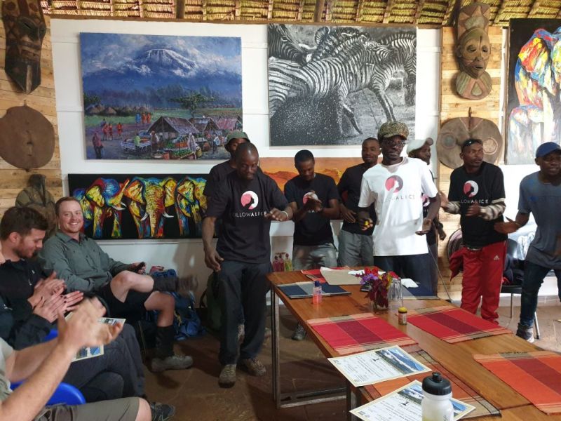 Indoor Follow Alice Kilimanjaro tipping ceremony