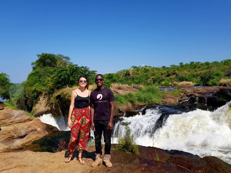Man and woman smiling at top of Murchison Falls