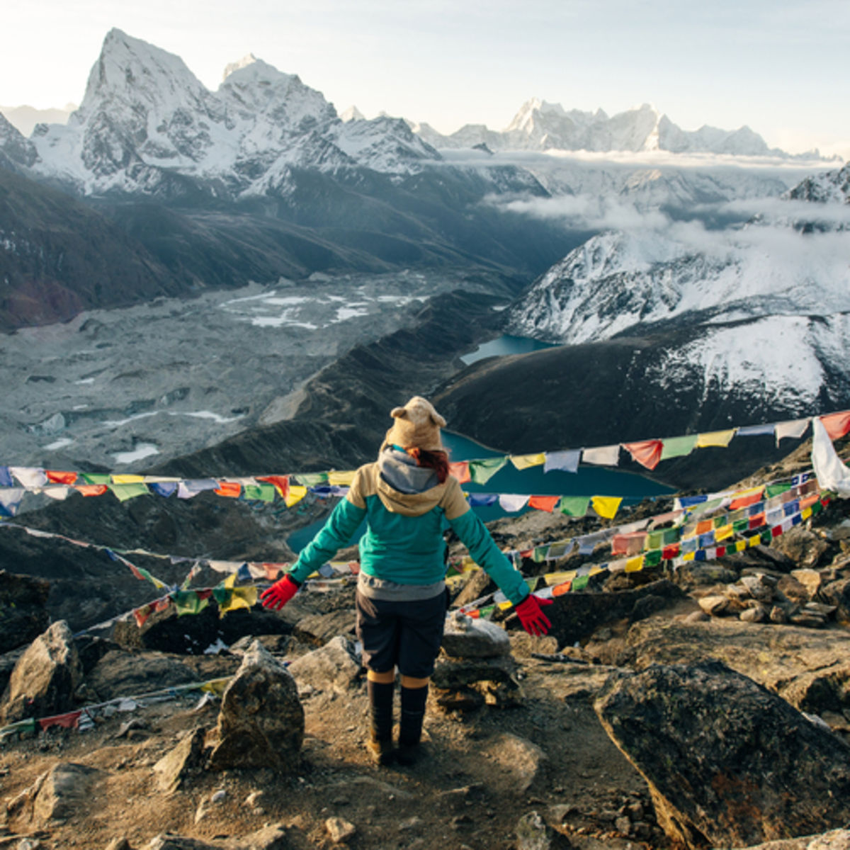 Woman trekker on Gokyo Ri looking at Gokyo Lakes, EBC trek