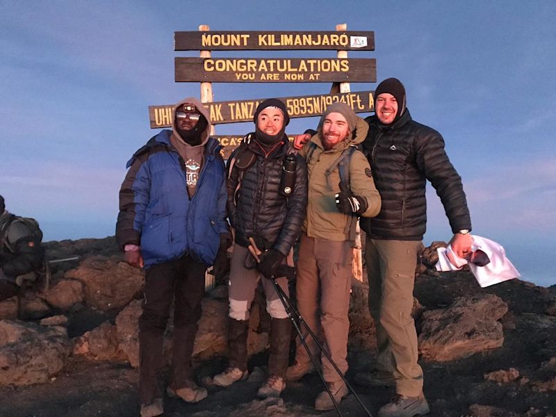 Trekkers at Uhuru Peak