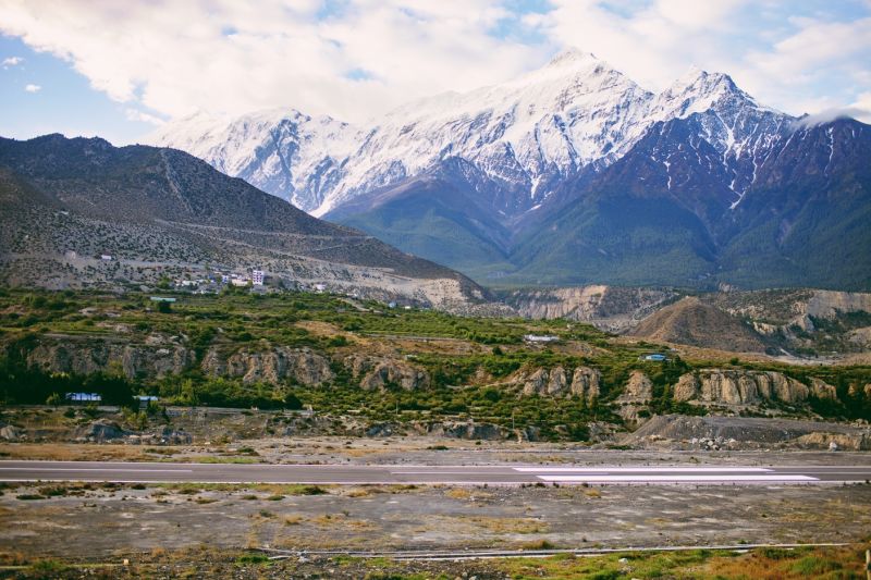 A view of the runway of Jomsom Airport among the Annapurna Mountains in Nepal
