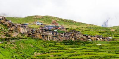 Green terraced fields and traditional architecture in the ancient Tibetan Nar village, Annapurna Conservation Area, Nepal