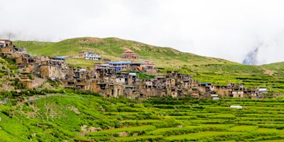 Green terraced fields and traditional architecture in the ancient Tibetan Nar village, Annapurna Conservation Area, Nepal