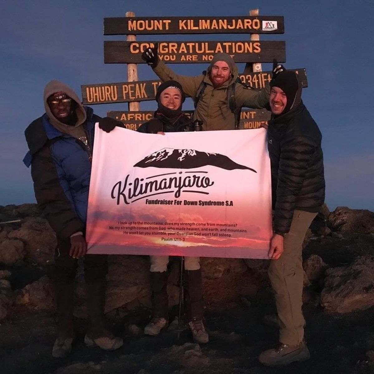 Dewald and Francois with Down Syndrome SA at Uhuru Peak with guides