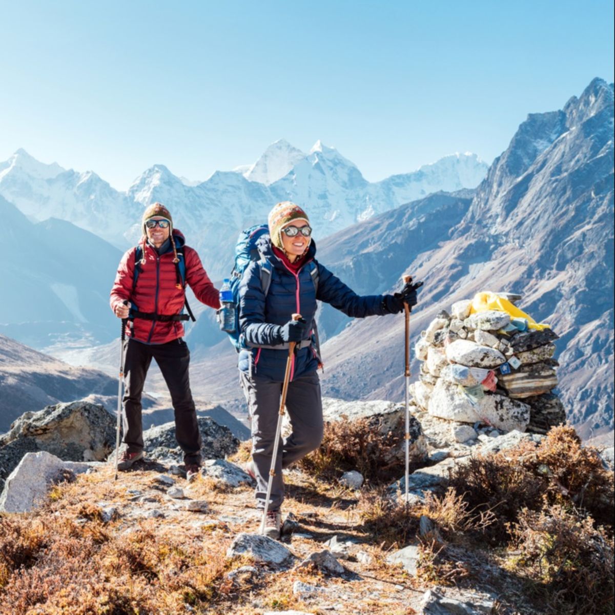 Trekkers with backpacks in mountains