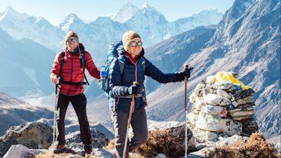 Trekkers with backpacks in mountains