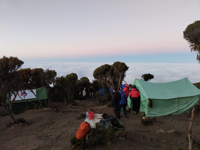 Evening in Mweka Camp on Kilimanjaro – Follow Alice tents and cloud bank below