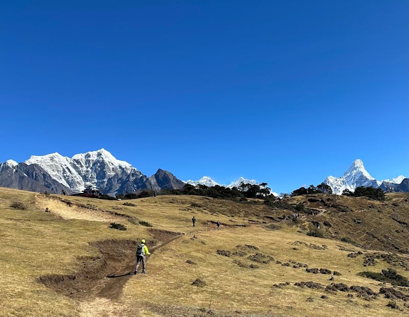 Ama Dablam and trekkers on ECB trek trail