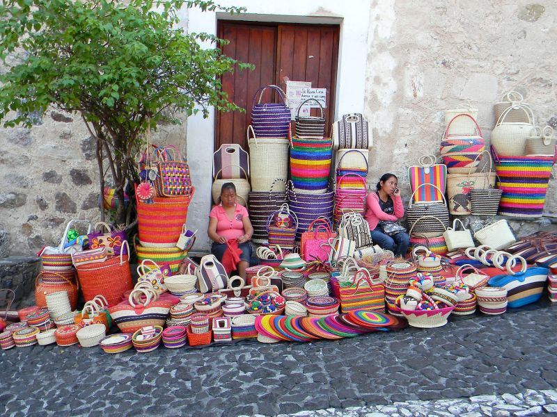Street vendors South America woven baskets two women