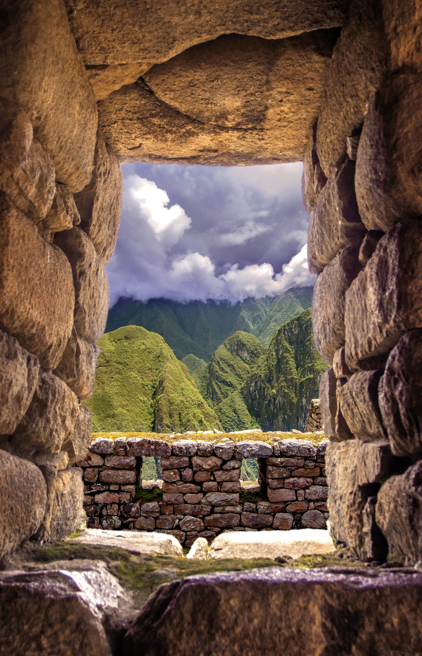 View through Inca window at Machu Picchu, Peru