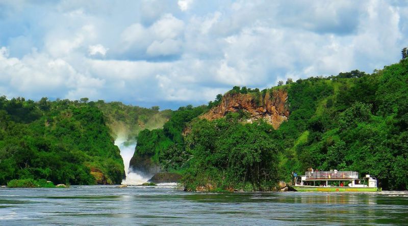 Boat cruise on Victoria Nile with Murchison Falls in distance