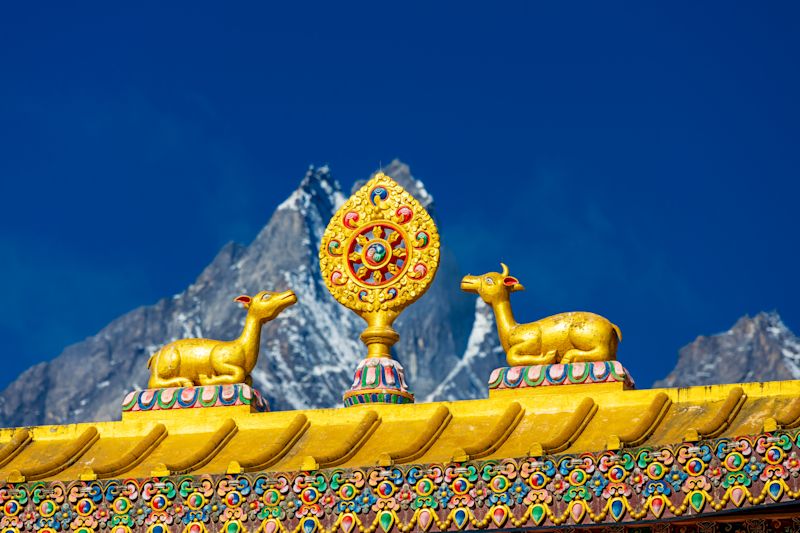 Gold statues and decorative detail atop a Buddhist temple in Namche Bazaar, Khumbu region, Himalayas of Nepal