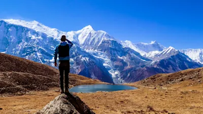 Trekker looking at mountain view in Nepal