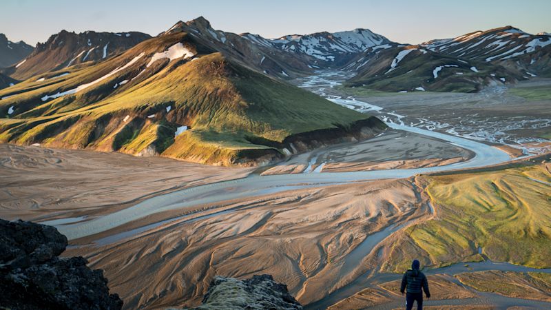 Trekker hiker Iceland interior hills mountains summer