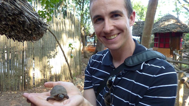 Girl poses with vintage door in Stone Town Zanzibar