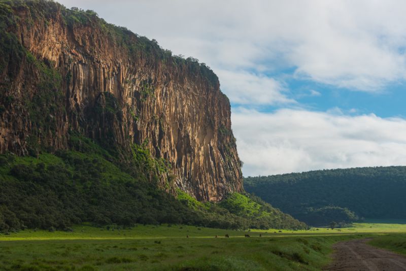 Cliff face in green rainy season of Hell-s Gate NP, Kenyan safari