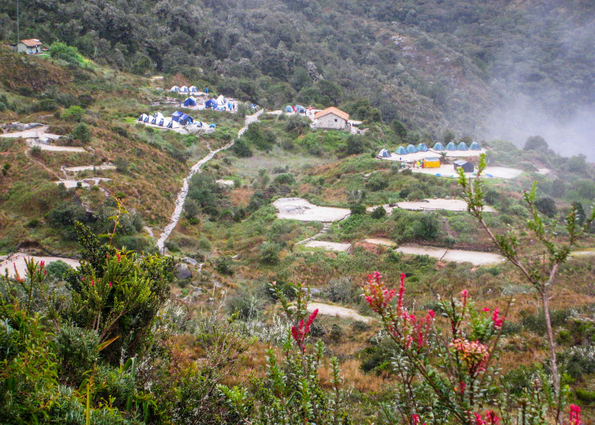 Hikers camp in the heart of the Andes mountains on the Inca Trail to Machu Picchu lost city in Peru