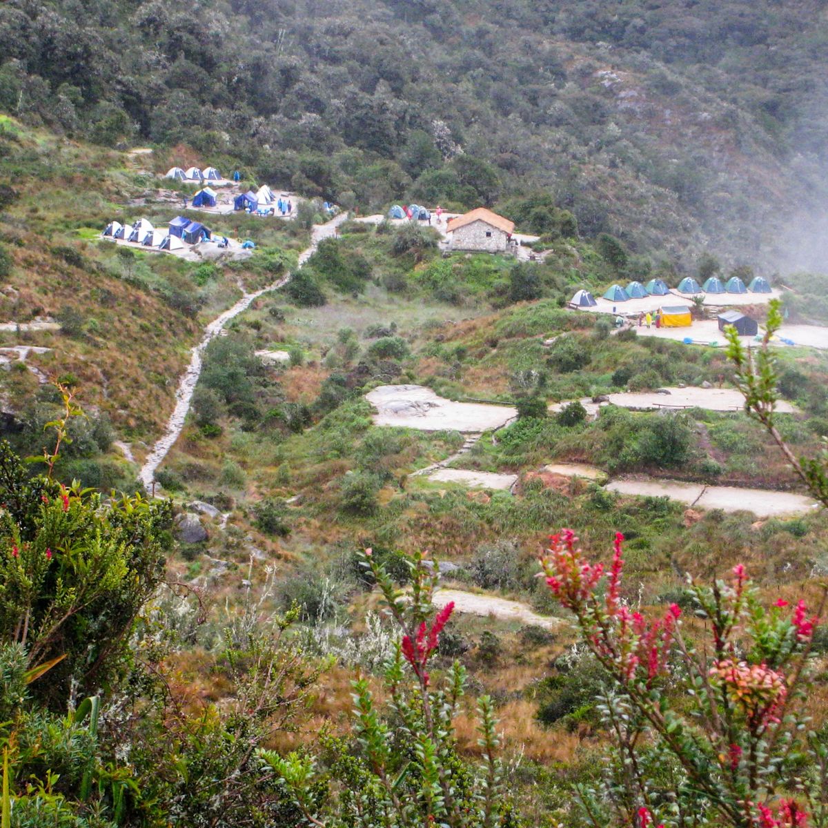 Hikers camp in the heart of the Andes mountains on the Inca Trail to Machu Picchu lost city in Peru