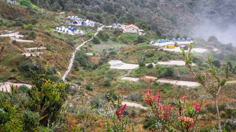 Hikers camp in the heart of the Andes mountains on the Inca Trail to Machu Picchu lost city in Peru