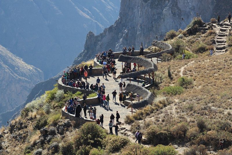 Tourists at a lookout point in Colca Canyon, Andes, Peru