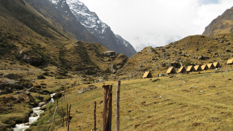 Glamping on Salkantay Trek – rustic-looking A-frame huts in Chaullay (2,900 m : 9,510 ft)