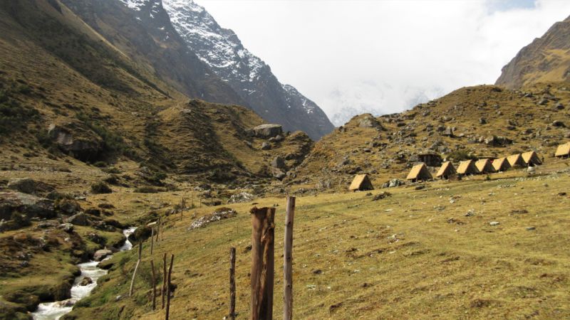 Glamping on Salkantay Trek – rustic-looking A-frame huts in Chaullay (2,900 m : 9,510 ft)