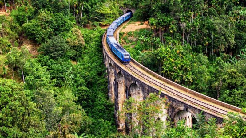 ch Bridge with blue train in Ella, Sri Lanka