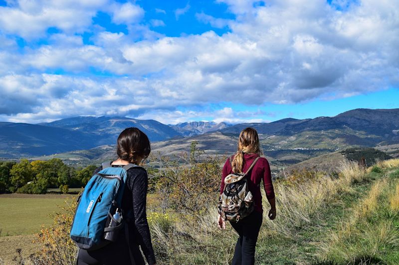 Two women hiking in countryside