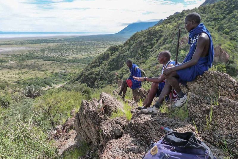 Maasai men sitting on rocks overlooking Lake Eyasi