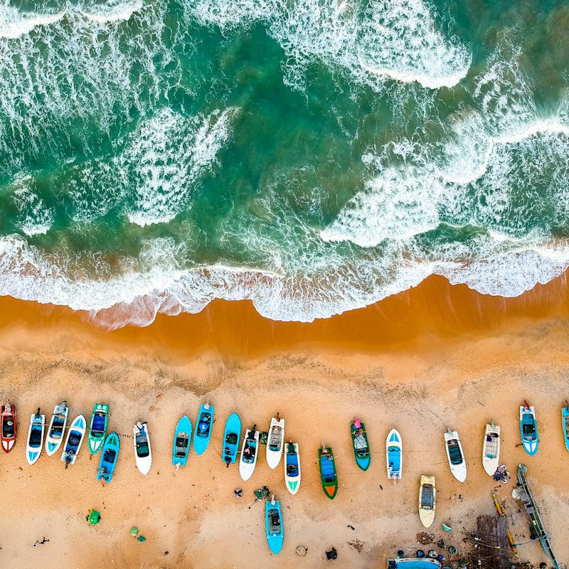 Aerial view of small boats on Sri Lankan beach