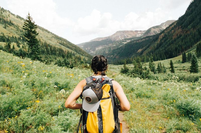 girl hiking mountains 10 things you must know before climbing Kilimanjaro 