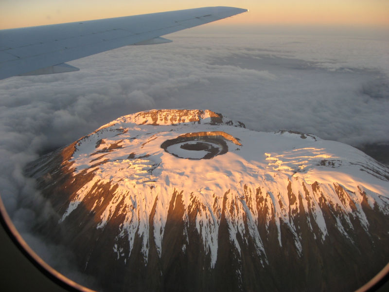 Snowy Kilimanjaro peak or summit seen from airplane