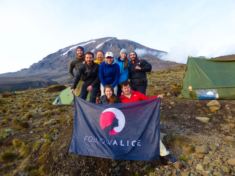 group photo with Follow Alice flag at Kilimanjaro campsite, What is it like to climb Kilimanjaro