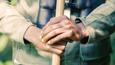 Tour guide with binoculars