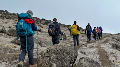 Trekkers climbing Mount Kilimanjaro