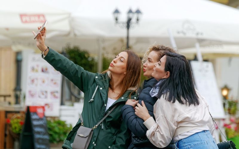 Three women posing for a selfie