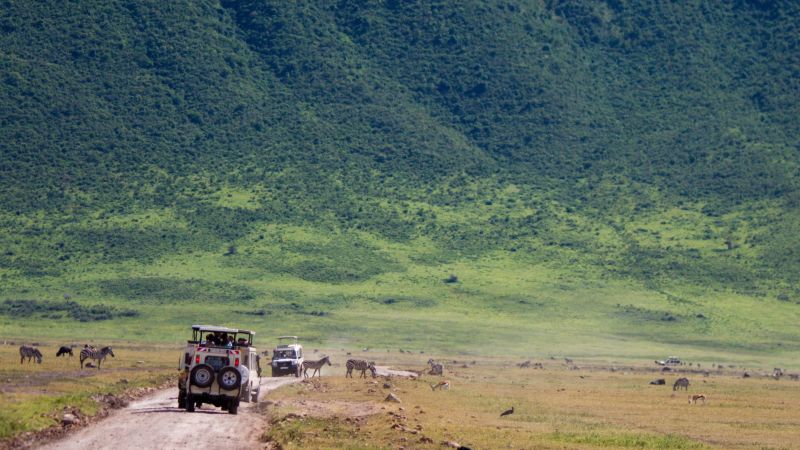 Safari vehicle on game drive in Ngorongoro Crater