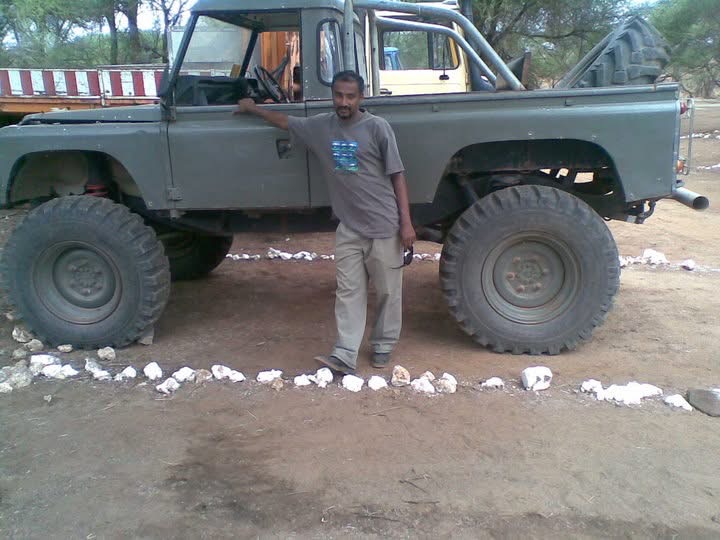 Khalfan standed and posing